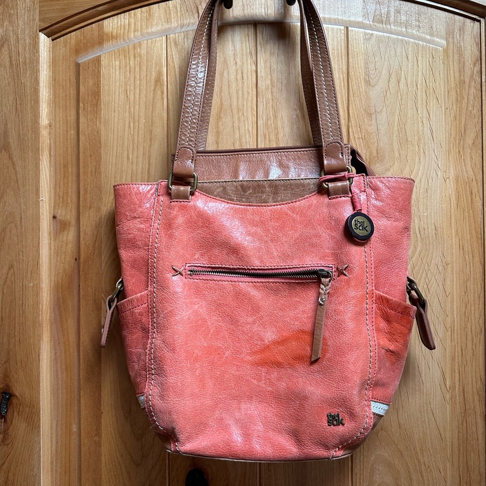 the Sak salmon / brown leather shoulder purse, EUC